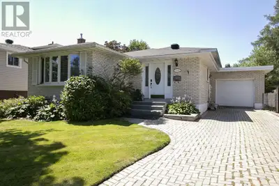 Welcome to this beautifully maintained backsplit offering over 2,000 square feet of finished living...