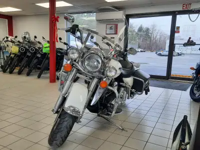 The 2004 Harley-Davidson Road King Classic is a timeless touring motorcycle known for its iconic sty...