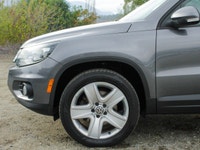 The 2012 Volkswagen Tiguan Highline in its sophisticated gray hue, paired with an agile AWD drivetra... (image 7)