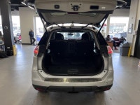 Meet the 2015 Nissan Rogue SL, a silver AWD SUV that perfectly combines robust handling with everyda... (image 7)