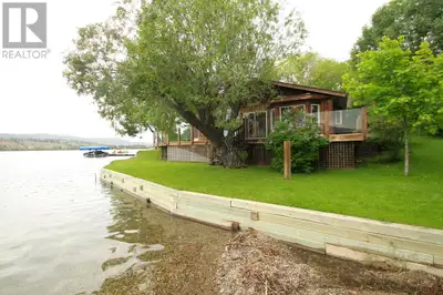 Close your eyes… and take a deep breath. Now picture this: a true, old-school lakefront cottage—but...