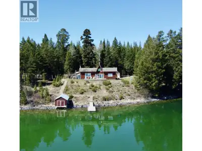 Nestled on 3.6 acres with nearly 170 ft of frontage on pristine Sheridan Lake, this east-facing wate...