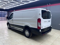 The 2024 Ford Transit Cargo Van T-250 130 Low Rf 9070 GVWR AWD in pristine white is a formidable veh... (image 4)