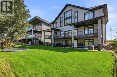 Welcome to lake life this unique and beautifully crafted custom two-story home perfectly positioned...