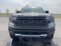 The 2024 Ford Ranger Raptor, finished in Shelter Green with refined Ebony leather-trimmed seats, is... (image 1)