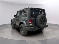 Get ready to command attention with the 2026 Jeep Wrangler Sport, a true symbol of adventure and rug... (image 2)