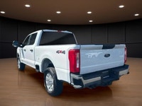 The 2023 Ford Super Duty F-250 SRW XLT in striking white comes equipped with a robust 4x4 drivetrain... (image 7)