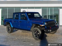 Conquer every landscape in this 2023 Jeep Gladiator Rubicon, gleaming in Hydro Blue Pearl. With only... (image 6)