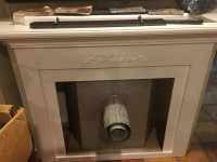 Natural gas fireplace with white mantel stove propane heater