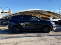 The Black Edition is essentially a fully-loaded Touring trim with a unique "blacked-out" styling pac... (image 1)