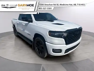 The 2025 Ram 1500 Sport, in a striking white finish, is ready to tackle any terrain with its reliabl...