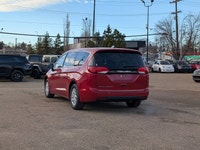 The 2026 Chrysler Grand Caravan SXT in Red Hot Pearl with a Black interior combines style, comfort,... (image 3)
