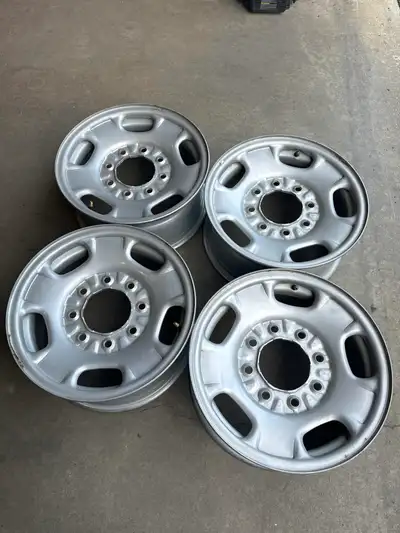 Four slightly used 17 inch OEM GMC or Chev 8 bolt steel rims. These rims will only fit GM or Chevrol...