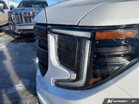 The 2026 GMC Sierra 1500 Elevation in a striking White finish is the perfect combination of power an... (image 8)