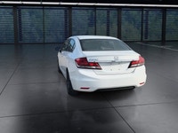 The 2014 Honda Civic Sedan LX, in a pristine white finish and equipped with a smooth front-wheel-dri... (image 6)