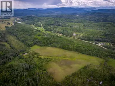 Incredible opportunity to own a secluded piece of property just minutes from Bragg Creek which backs...