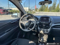 This 2021 Chevrolet Spark 1LT hatchback offers practical city driving with surprising versatility. I... (image 8)