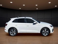 The 2021 Audi Q5 Komfort 45 TFSI quattro boasts a stunning white exterior that is both timeless and... (image 4)