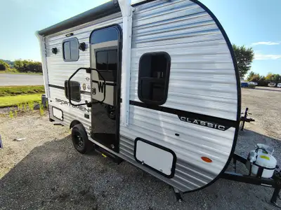 KZ Sportsmen Classic travel trailer 130BH highlights: 54 x 80 Bed Two Burner Cooktop 9' Awning Sleep...