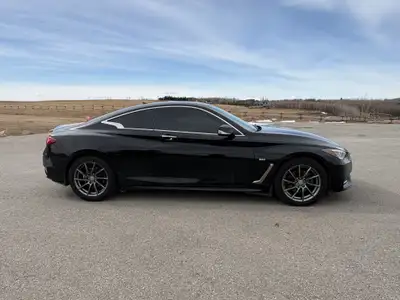 The 2017 Infiniti Q60 Premium is a luxurious 2-door coupe, often featuring a 300-horsepower 3.0L twi...