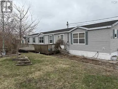 Are you looking for convenient one level living? This 16x72 mini home on a large corner lot features...