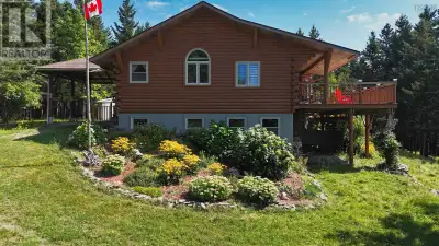 This spacious, well-maintained Log House is situated on approximately 25 acres of land with stunning...