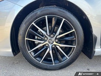 The *2024 Toyota Camry Hybrid SE* combines aggressive sport styling with class-leading fuel efficien... (image 8)