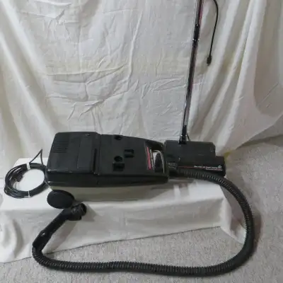 -vacuum complete with flexible hose, chrome extension wand and specialized "Bare Floor and Carpet" p...