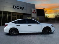 The 2025 Honda Civic Sedan Hybrid Sport in a stunning white finish combined with its FWD drivetrain... (image 3)
