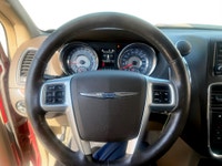 A spacious family minivan with comfortable seating, convenient features, and versatile cargo space,... (image 9)