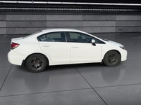 The 2014 Honda Civic Sedan LX, in a pristine white finish and equipped with a smooth front-wheel-dri... (image 8)