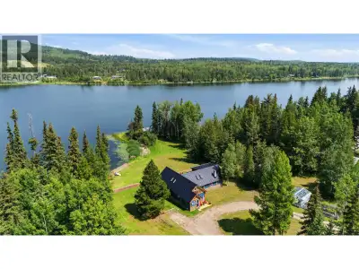 Lakefront gem on 2.26 acres of beautifully maintained, level land on Rose Lake. This charming proper...