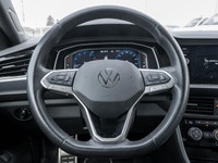 The 2024 Volkswagen Jetta Comfortline stands out in a refined White finish that complements its slee... (image 9)