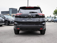 The 2023 Nissan Rogue AWD S in a sleek black hue complements its AWD capabilities, delivering a smoo... (image 3)