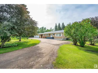 Exceptional private equestrian acreage just minutes from Sherwood Park! Nestled on beautifully treed...