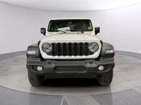 The 2026 Jeep Wrangler Sport 2 Door 4x4, presented in a striking white color, is equipped with a res... (image 7)