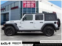 The 2022 Jeep Wrangler Unlimited Willys 4x4 in a classic white exterior and rugged 44 drivetrain is... (image 4)