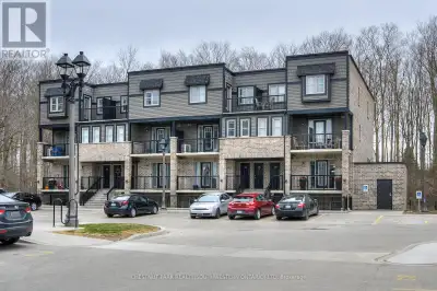 This beautiful MAIN FLOOR stacked townhome shows like a model and features over 865 square feet of b...