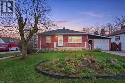 Welcome to this beautifully maintained brick bungalow situated on a manicured 54' x 100' corner lot...