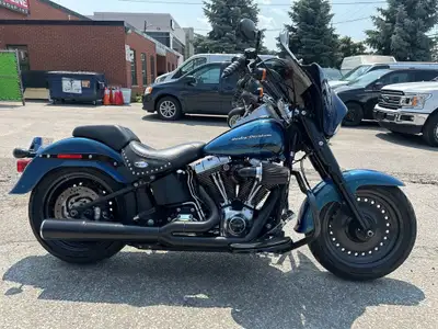 Check out this 2014 CANADIAN Daytona Blue 103cu Harley-Davidson Fat Boy with only 53,542kms. Be sure...
