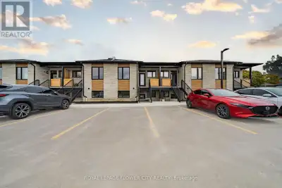 Contemporary 2-bedroom, 2-bathroom stacked townhome featuring a bright open-concept layout. The cust...