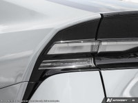 Introducing the stunning 2027 Toyota Prius Plug-In Hybrid XSE in a sleek silver finish with a smooth... (image 9)