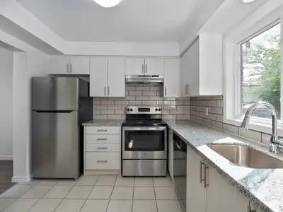 Newly Renovated Townhouses with Spacious Backyards and In Suite Laundry Welcome to 414 Stone Road We...