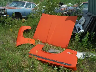 I have a front clip off a 72 Duster fenders and hood, auto console, bucket seats disc brakes much mo...