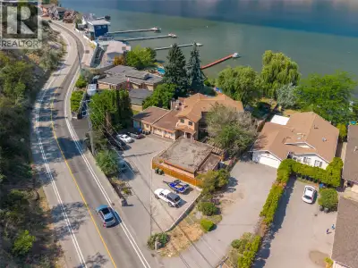Stunning waterfront home on Skaha Lake offering panoramic views of the lake and mountains. This uniq...