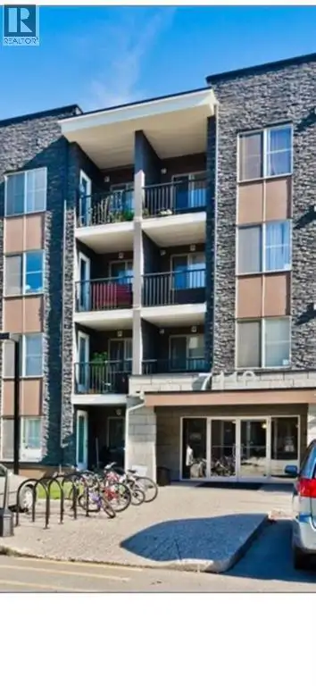 TOP-FLOOR 2-bedroom, 2-bath unit with a versatile flex area within an open-concept floor plan. The k...