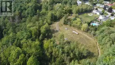 An opportunity with endless potential awaits on this expansive 2.5+ acre parcel, perfectly situated...