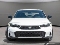 Introducing the 2026 Honda Civic Hybrid in a stunning white finish, this new sedan promises sophisti... (image 1)