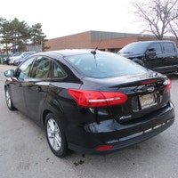 This 2016 Ford Focus SE is a reliable sedan with a sleek black exterior and a stylish charcoal inter... (image 5)