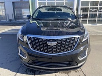 The 2024 Cadillac XT5 Standard AWD, finished in Stellar Black Metallic, combines refined styling, ad... (image 1)